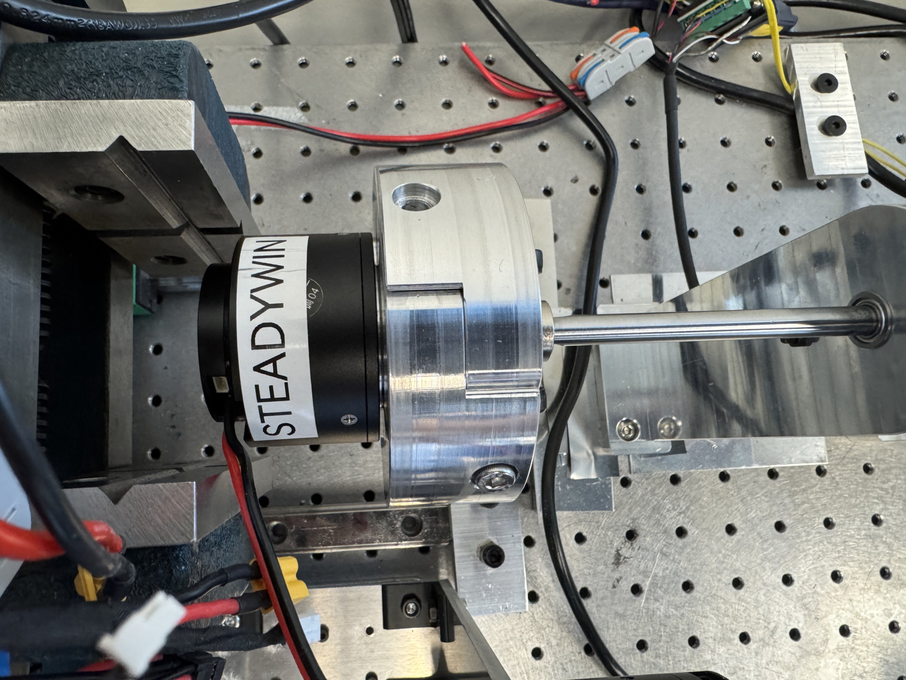 A SteadyWin actuator secured in the adjustable mount and connected to the test shaft
